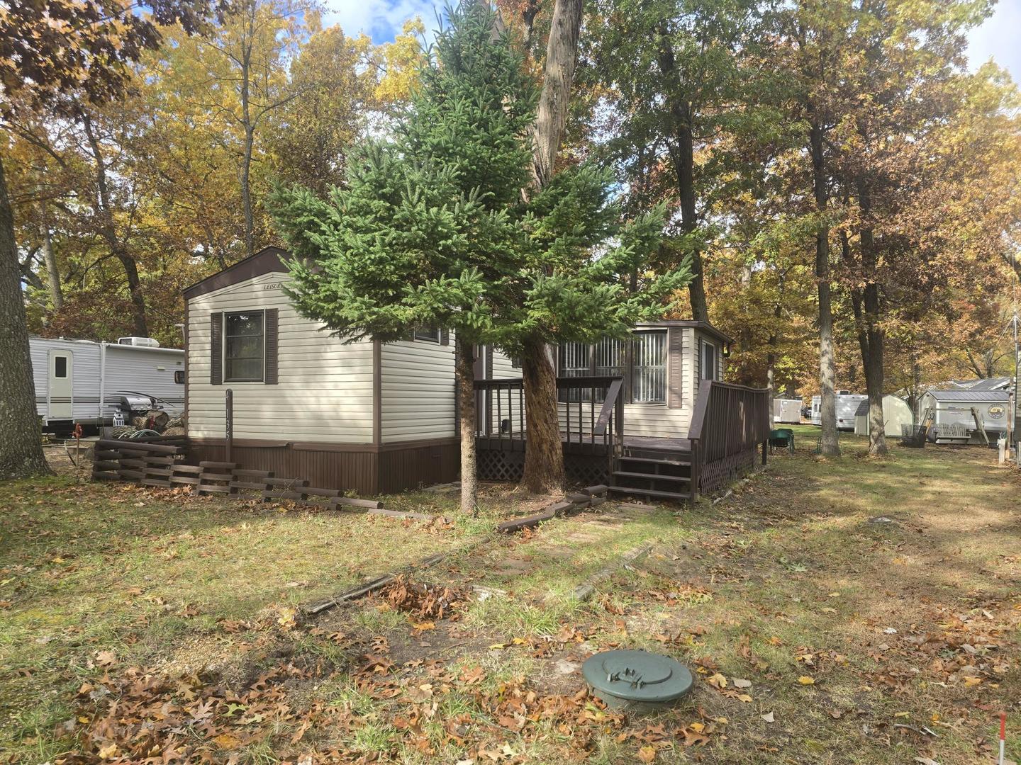 a house that has a tree in front of it