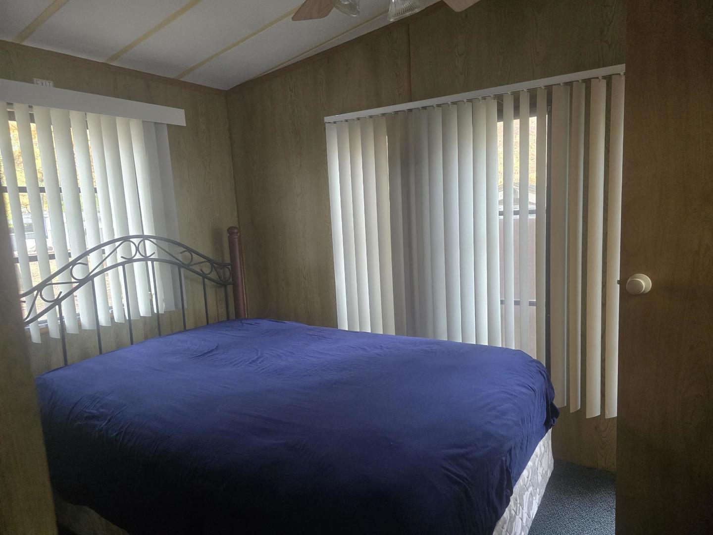 4-135 Woodhaven Sublette, IL 61367 - Photo 13 of 15 a bedroom with a bed and a window