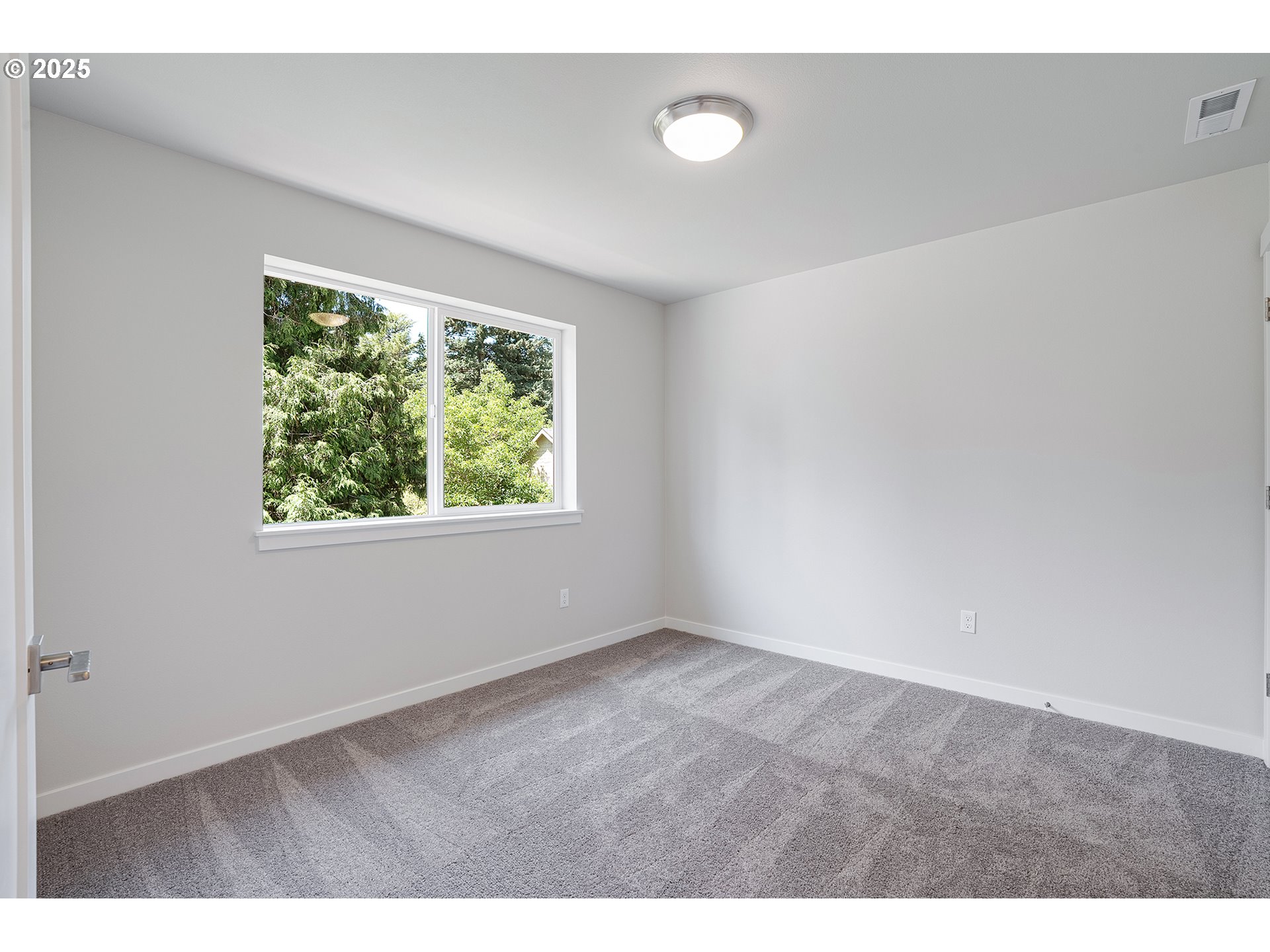 15133 East Burnside Street Portland, OR 97233 - Photo 13 of 21 a view of an empty room with a window