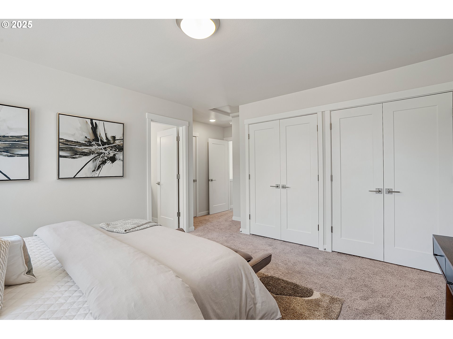 15133 East Burnside Street Portland, OR 97233 - Photo 17 of 21 a bedroom with a bed and painting on the wall
