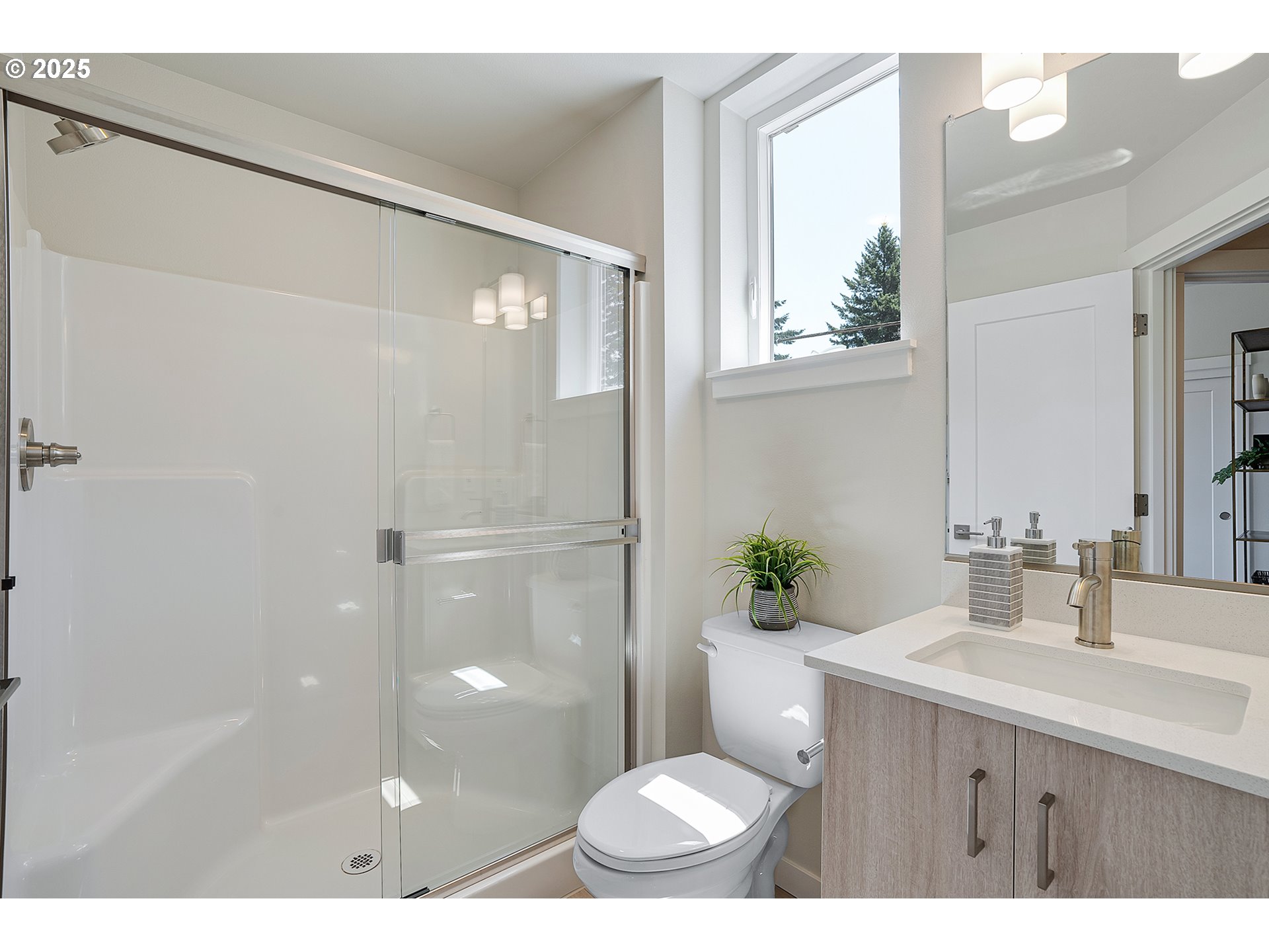 15133 East Burnside Street Portland, OR 97233 - Photo 9 of 21 a bathroom with a sink a toilet a shower and a mirror