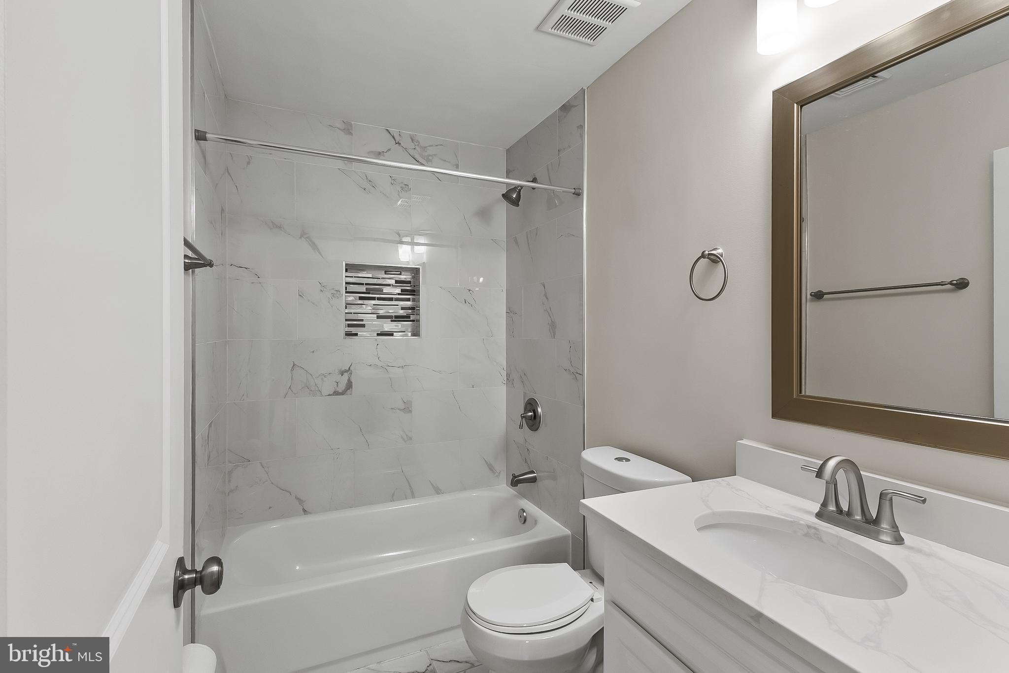 10546 Worton Road Worton, MD 21678 - Photo 15 of 33 a bathroom with a sink toilet and shower