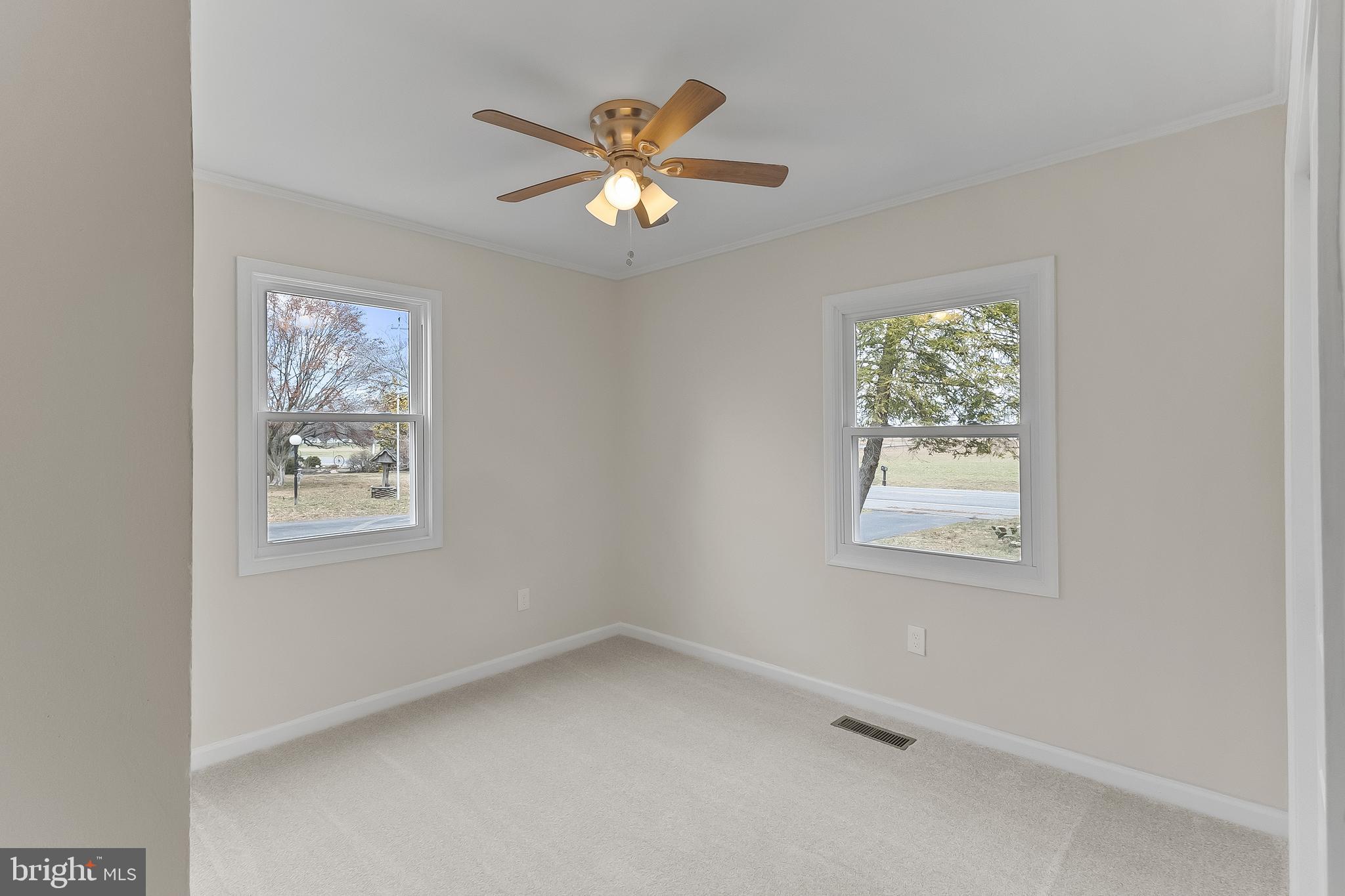 10546 Worton Road Worton, MD 21678 - Photo 17 of 33 an empty room with windows and fan