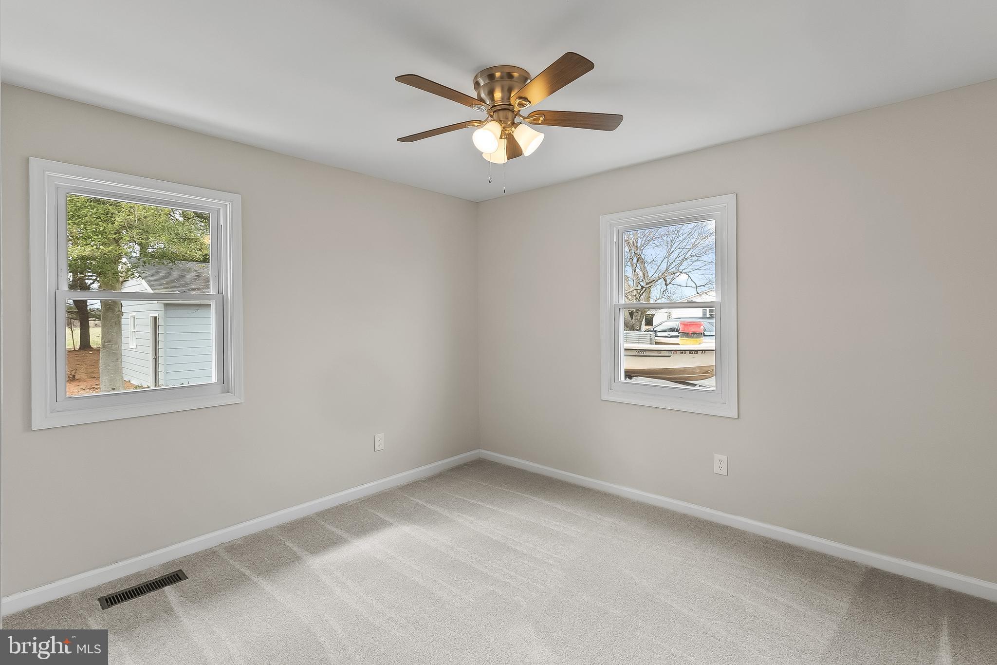 10546 Worton Road Worton, MD 21678 - Photo 19 of 33 an empty room with window and ceiling fan