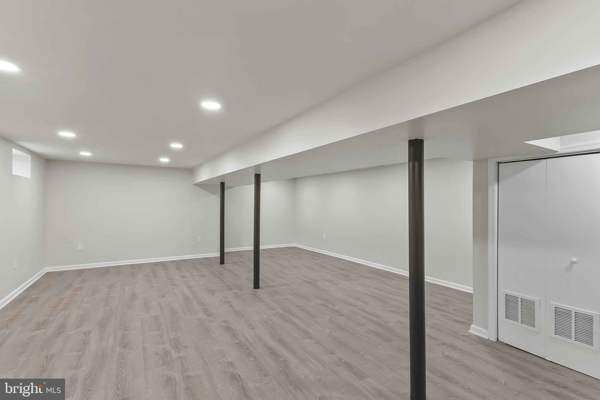 10546 Worton Road Worton, MD 21678 - Photo 22 of 33 an empty room with wooden floor and windows