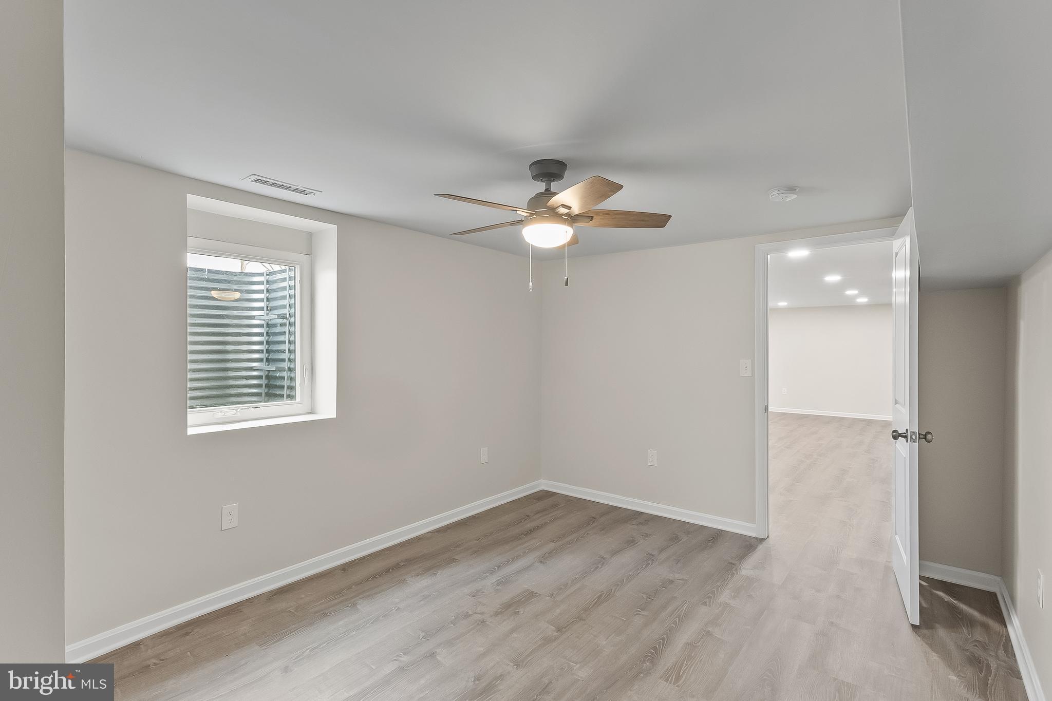 10546 Worton Road Worton, MD 21678 - Photo 26 of 33 wooden floor in an empty room with a window