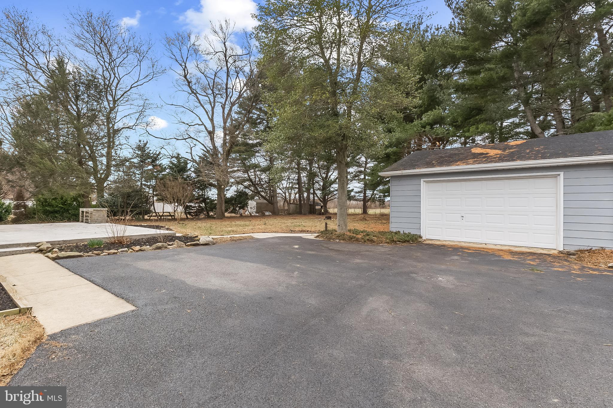 10546 Worton Road Worton, MD 21678 - Photo 29 of 33 a view of the house with a yard and garage