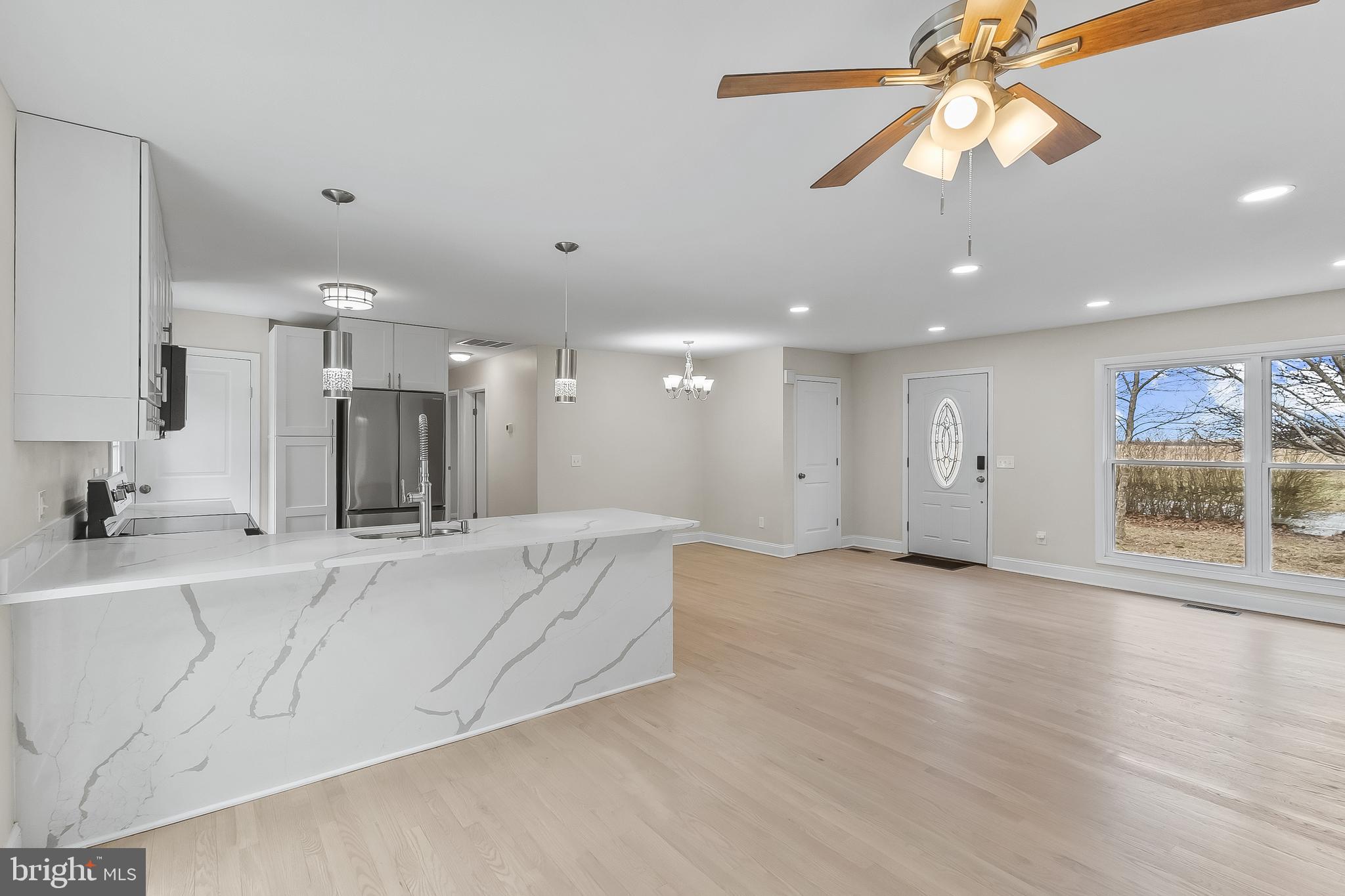 10546 Worton Road Worton, MD 21678 - Photo 5 of 33 a large white kitchen with a large window appliances and cabinets