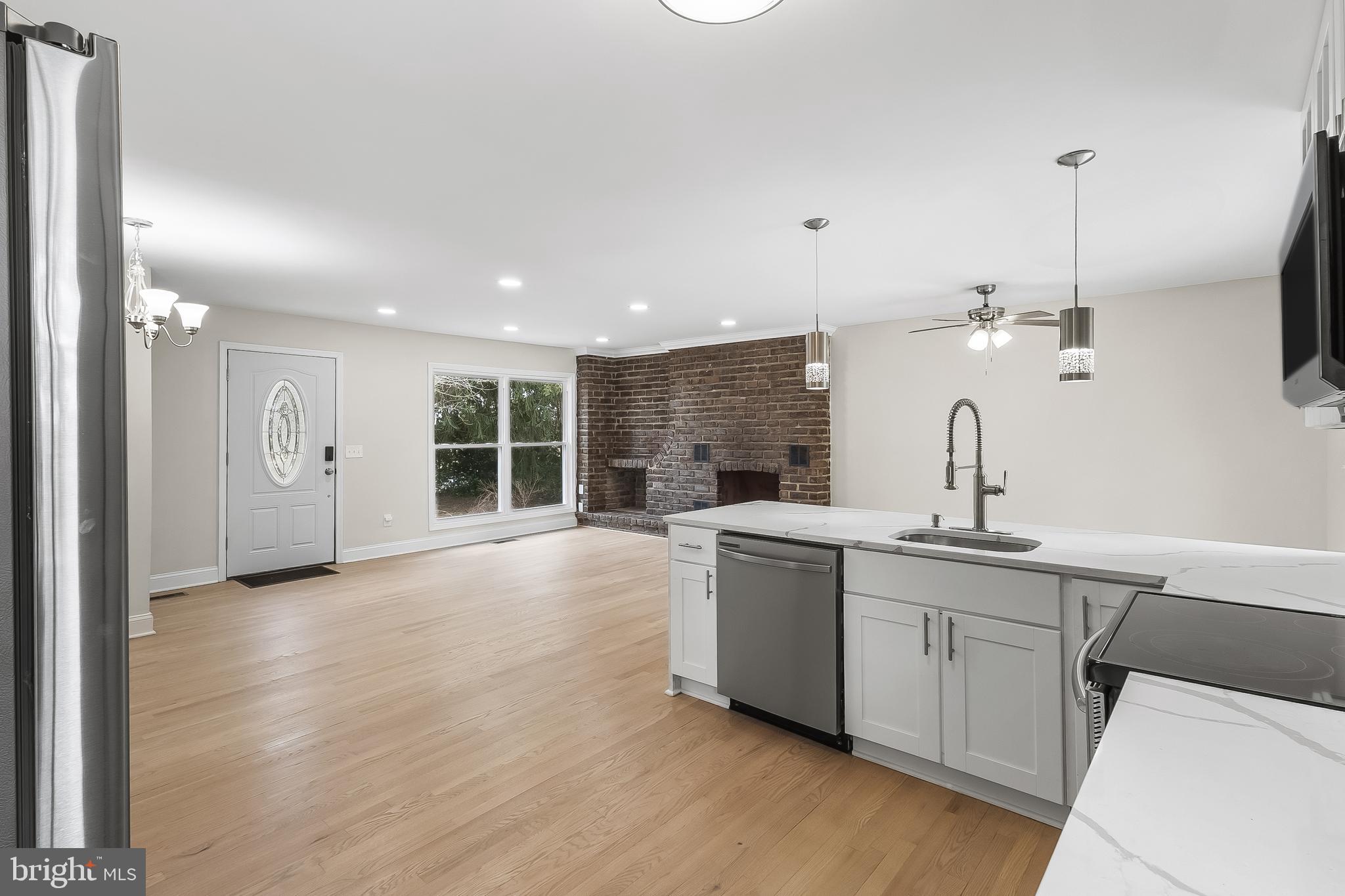 10546 Worton Road Worton, MD 21678 - Photo 9 of 33 a kitchen with a sink and chandelier