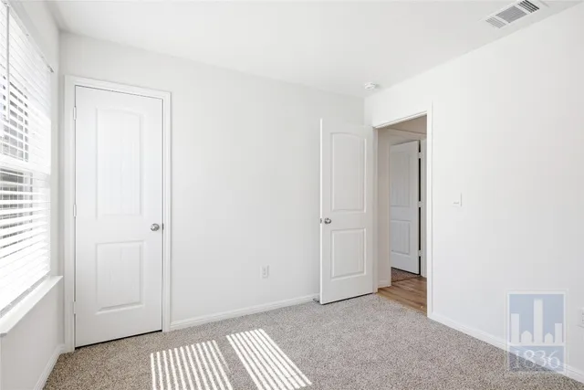 a view of a room with a wardrobe space