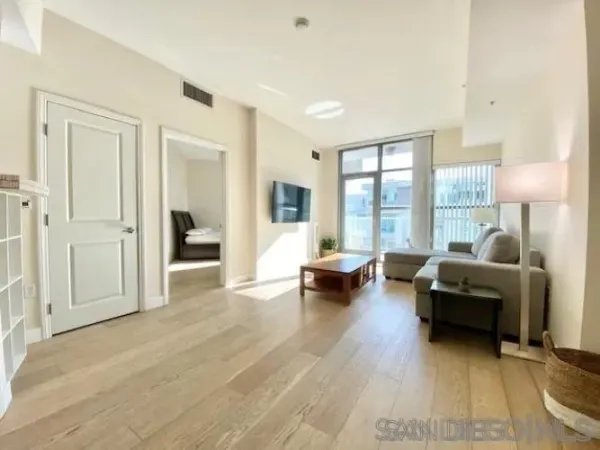 a living room with furniture and a large window