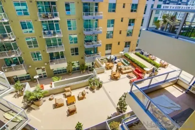 a balcony with furniture and flowers