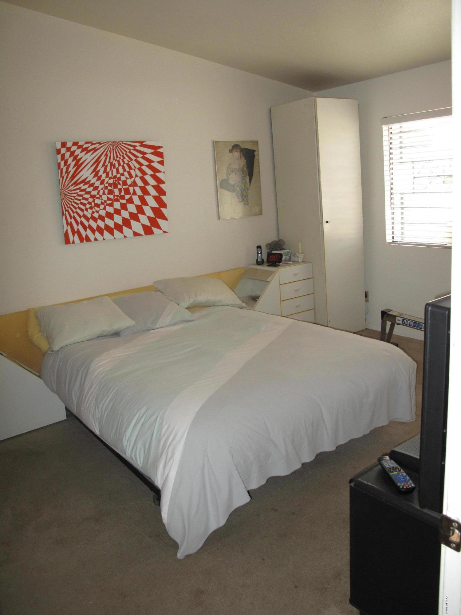 2520 West Fanbrook Road Tucson, AZ 85741 - Photo 13 of 18 a bedroom with a bed and a television