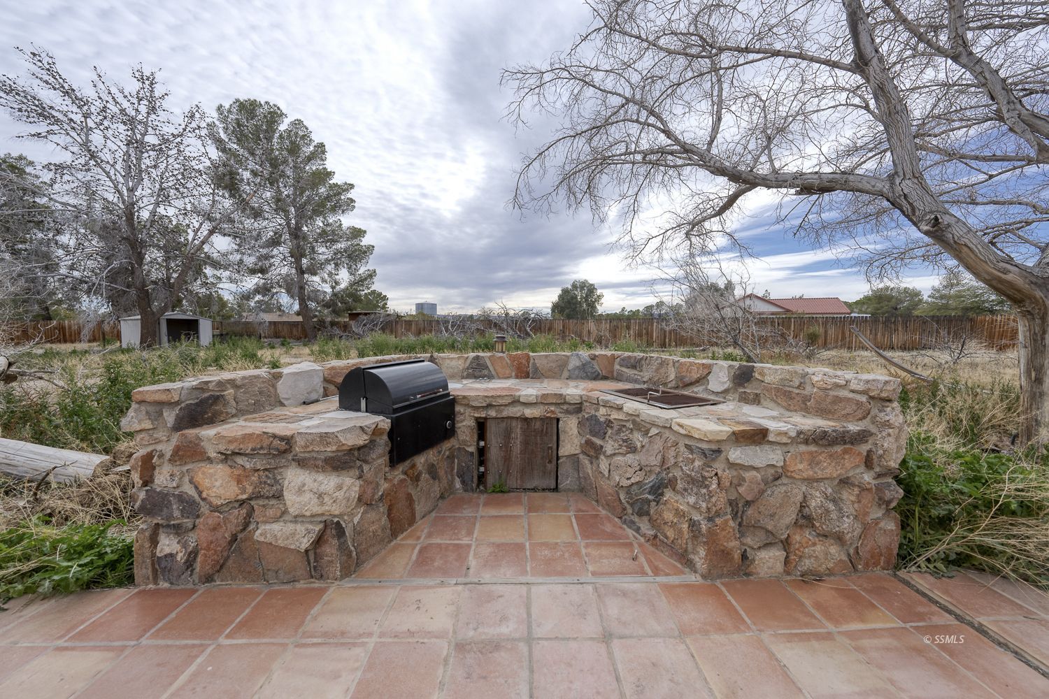 854 Campbell Street Ridgecrest, CA 93555 - Photo 28 of 45 a backyard of a house with table and chairs