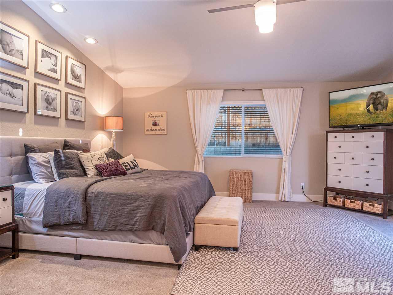 2435 Foley Way Reno, NV 89509 - Photo 17 of 32 a bedroom with a bed and a dresser