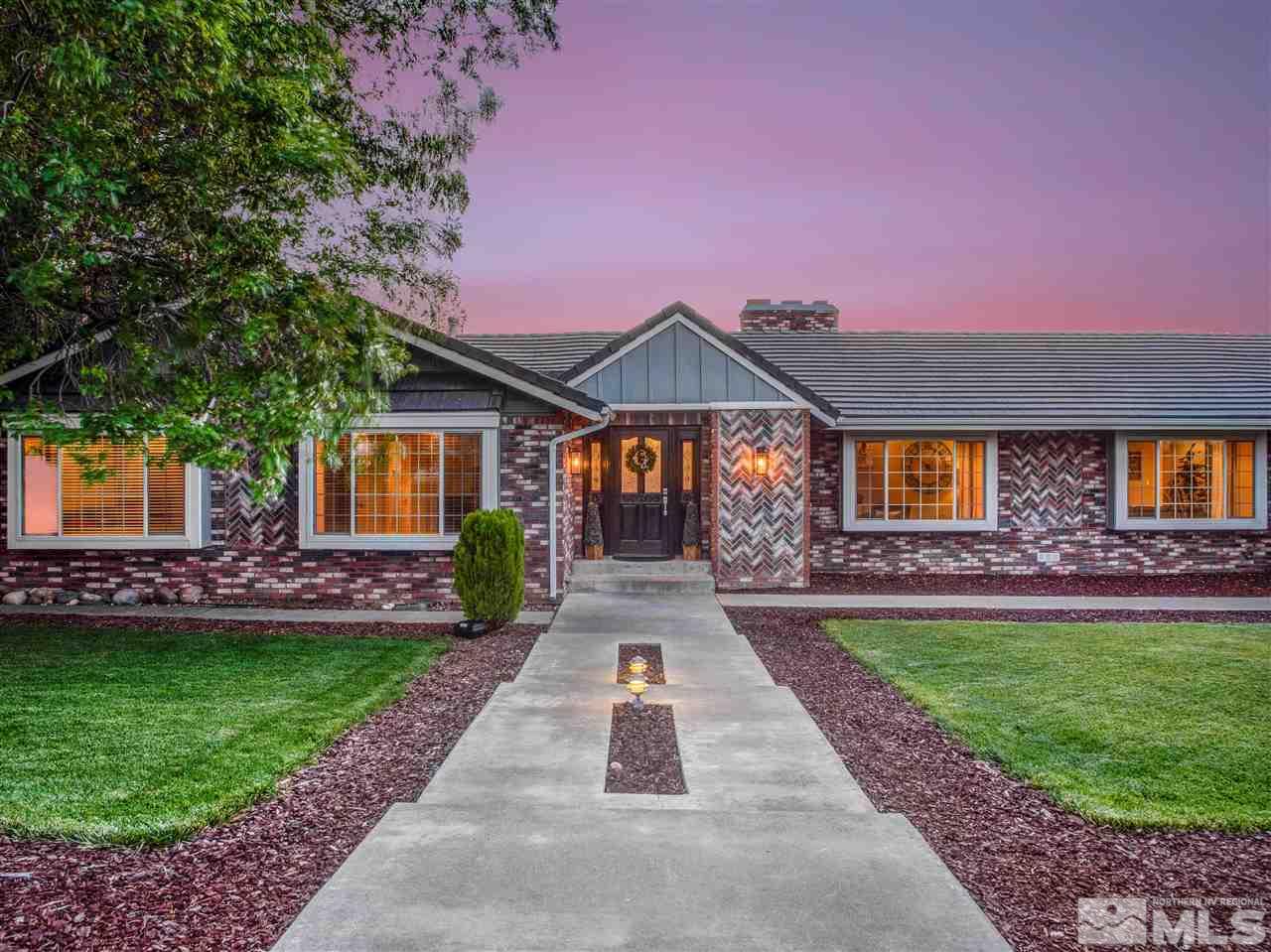2435 Foley Way Reno, NV 89509 - Photo 2 of 32 a front view of a house with a yard