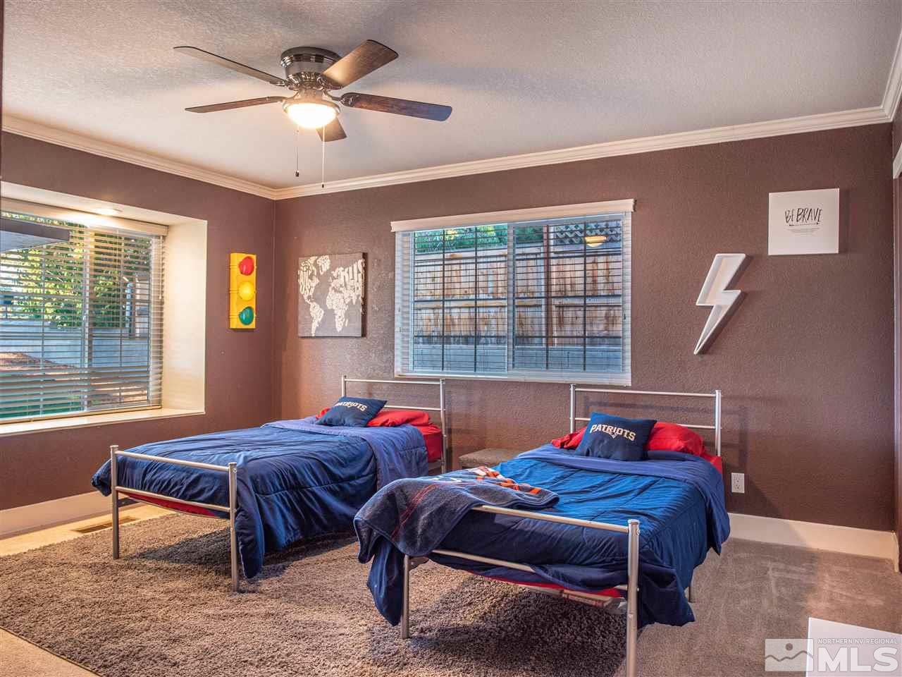 2435 Foley Way Reno, NV 89509 - Photo 21 of 32 a bedroom with two beds and windows