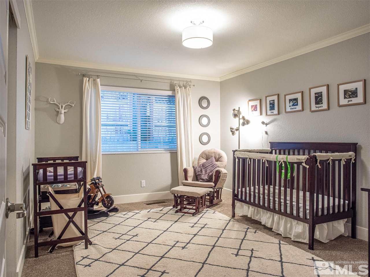 2435 Foley Way Reno, NV 89509 - Photo 23 of 32 a bedroom with furniture and a window