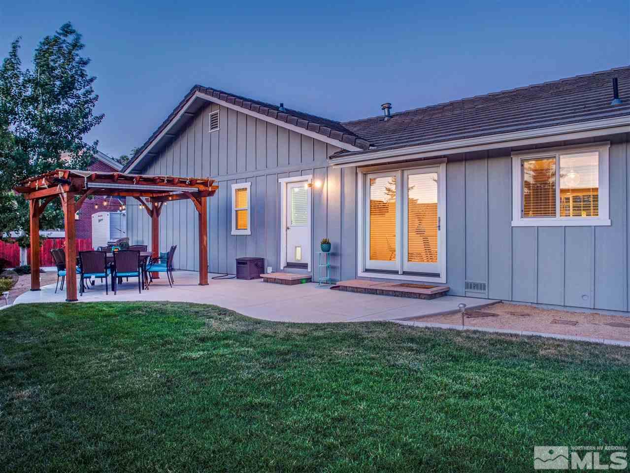 2435 Foley Way Reno, NV 89509 - Photo 25 of 32 a front view of house with yard and outdoor seating