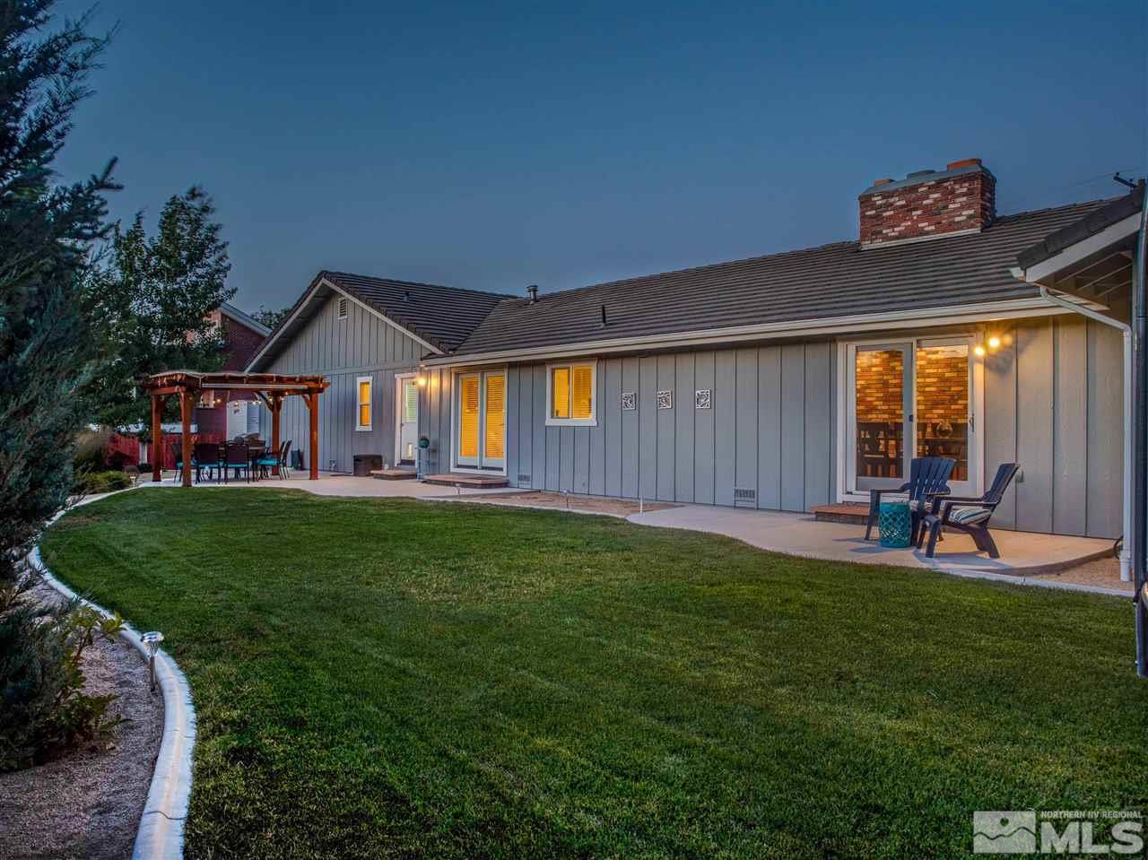 2435 Foley Way Reno, NV 89509 - Photo 27 of 32 a view of a house with a backyard porch and sitting area