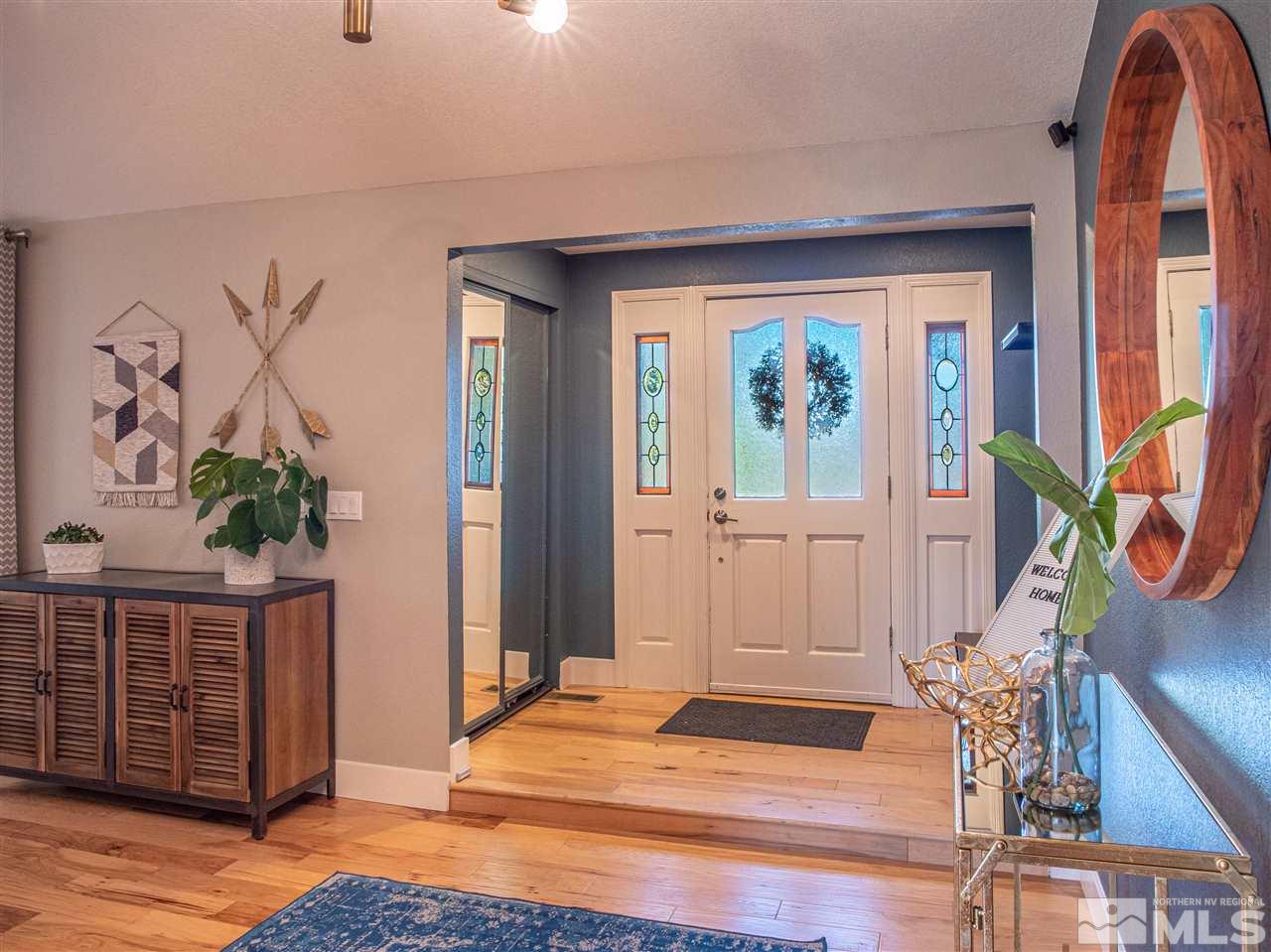 2435 Foley Way Reno, NV 89509 - Photo 4 of 32 a view of front door with furniture and a window