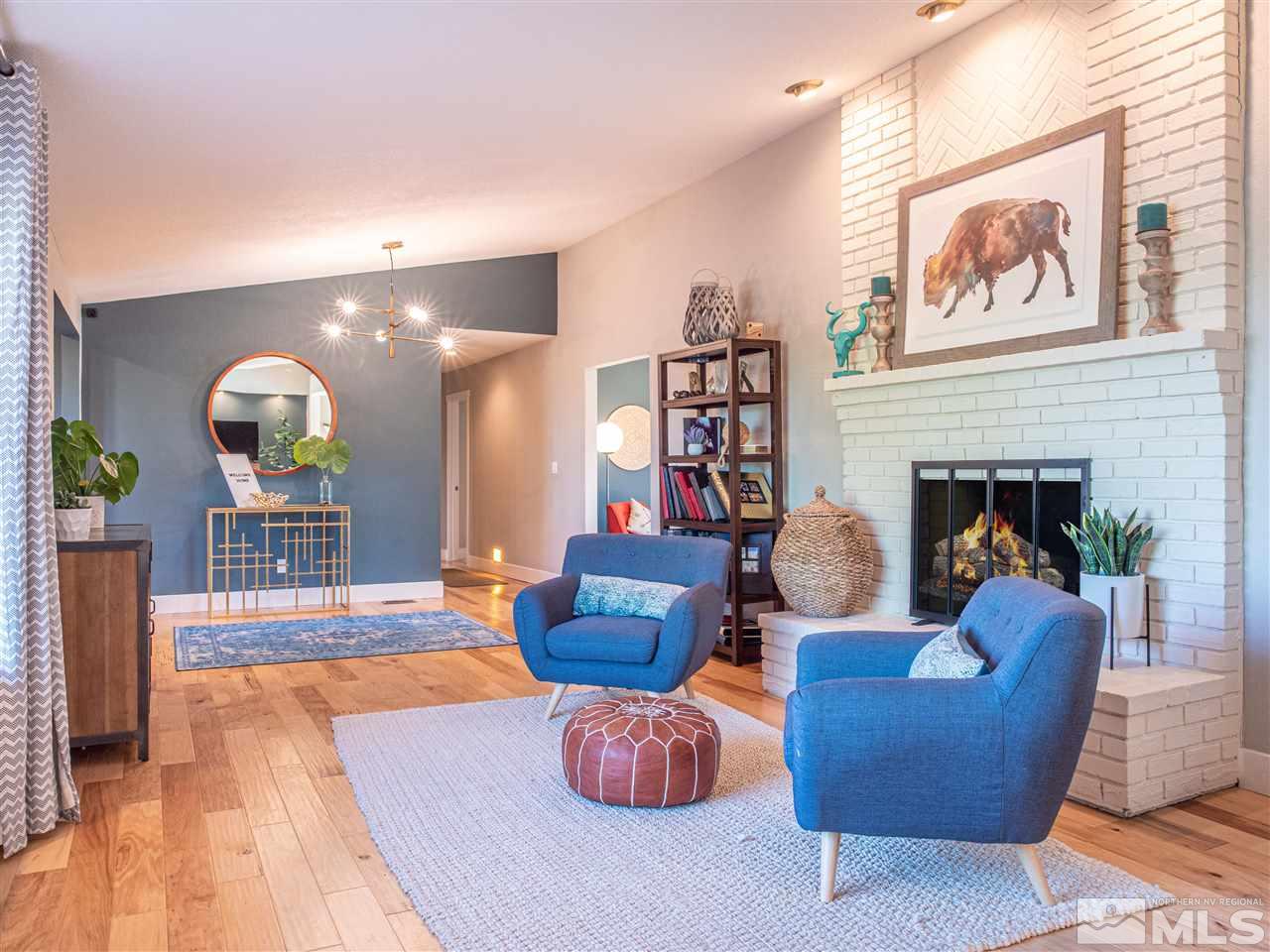 2435 Foley Way Reno, NV 89509 - Photo 6 of 32 a living room with furniture and a fireplace