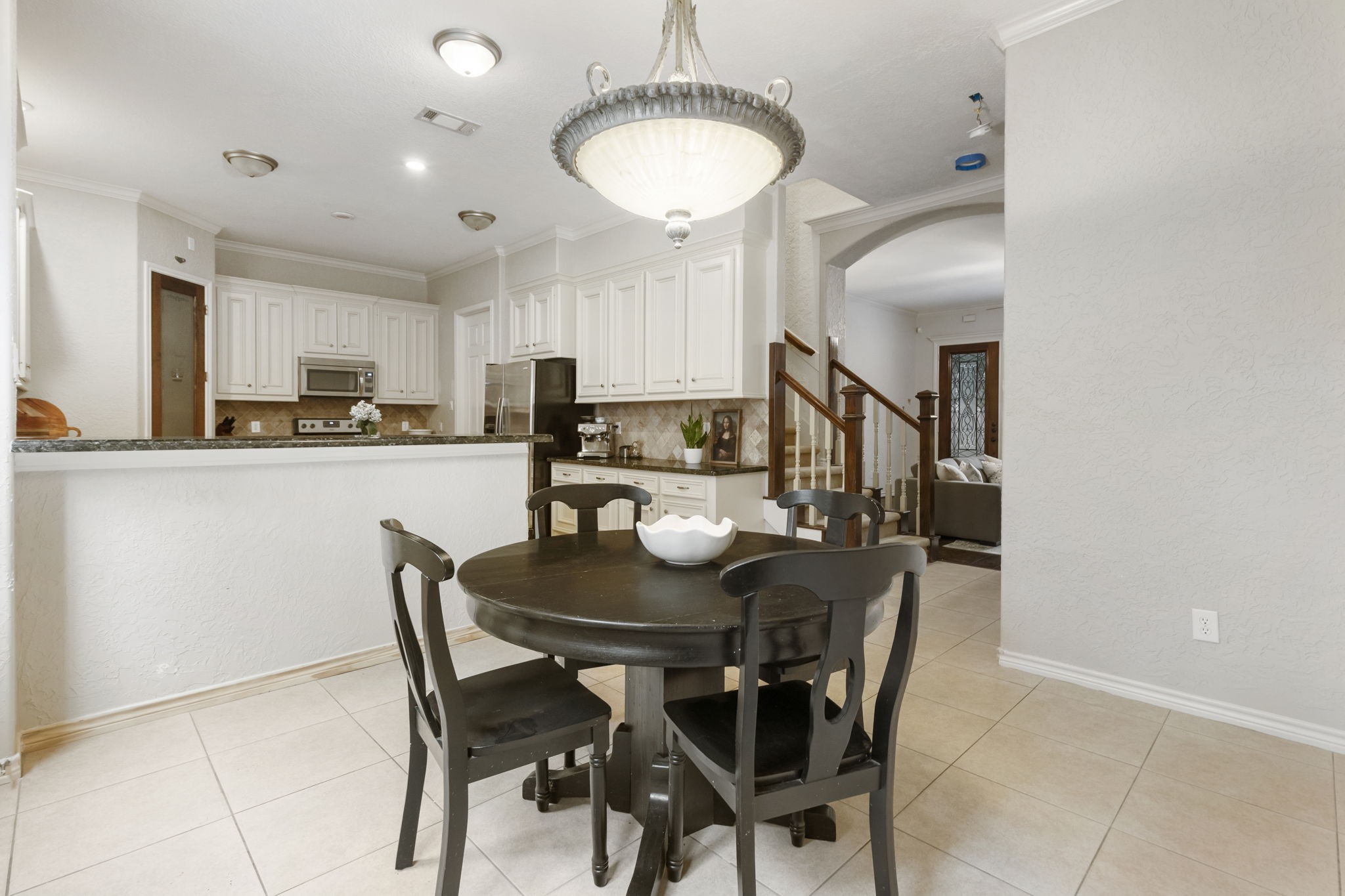 1898 Longmire Road, Unit 8 Conroe, TX 77304 - Photo 11 of 26 a view of a dining room with furniture and wooden floor