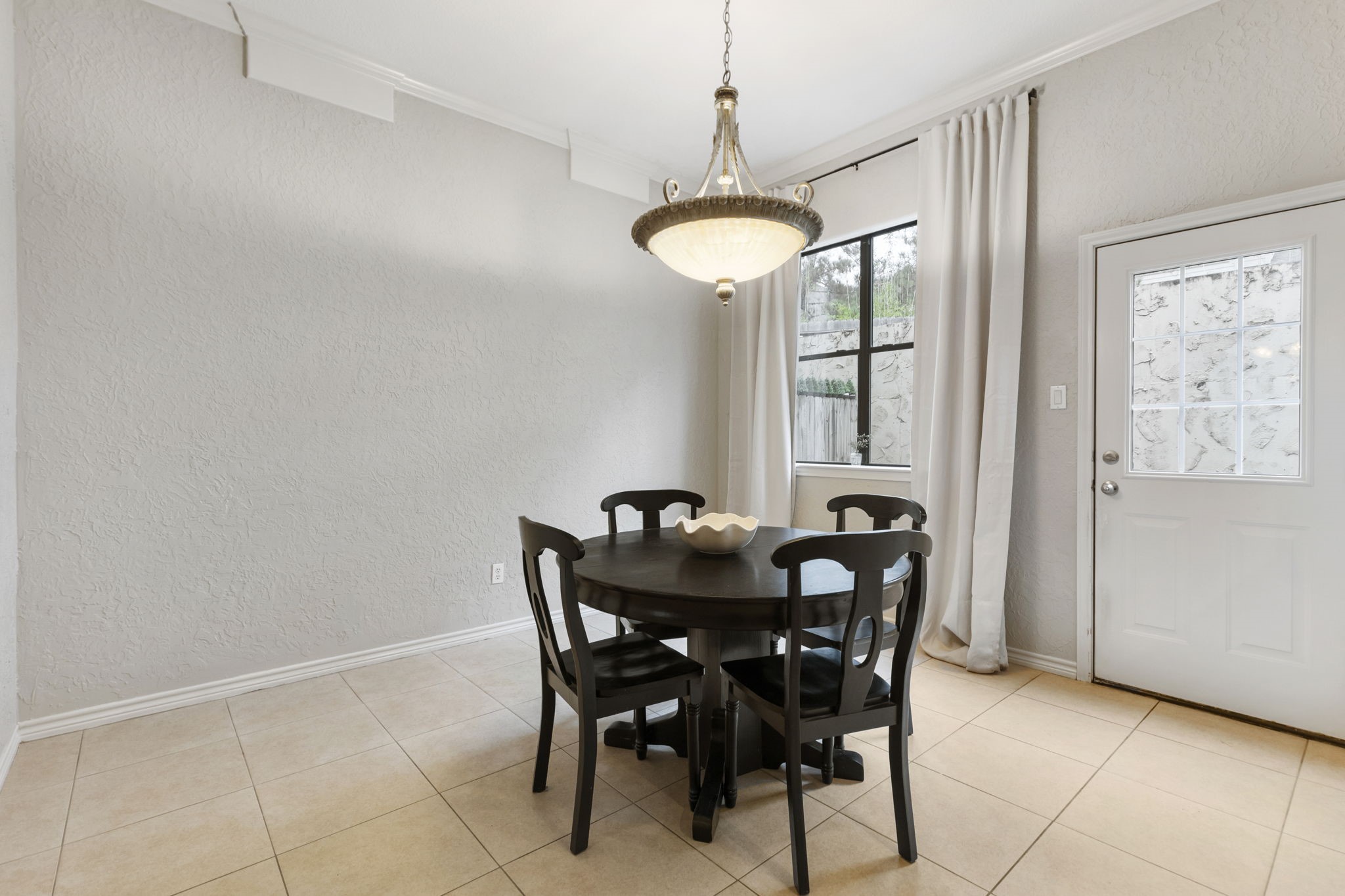 1898 Longmire Road, Unit 8 Conroe, TX 77304 - Photo 12 of 26 a view of a dining room with furniture and window