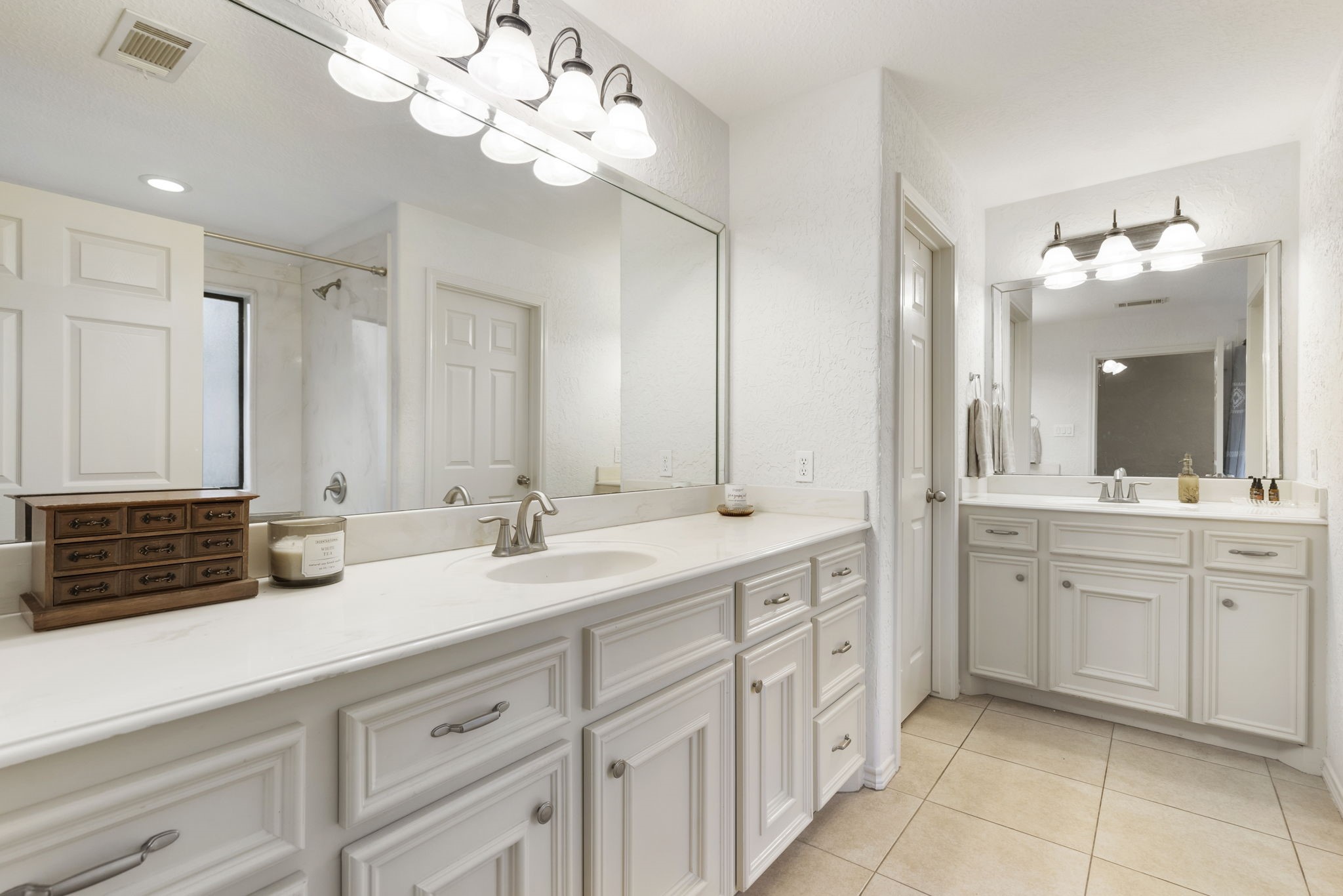 1898 Longmire Road, Unit 8 Conroe, TX 77304 - Photo 19 of 26 a bathroom with a sink vanity and mirror