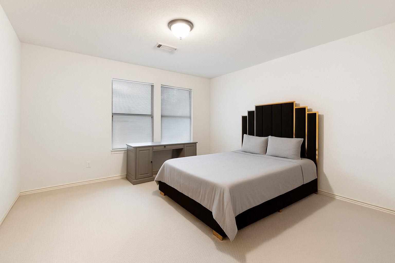 1898 Longmire Road, Unit 8 Conroe, TX 77304 - Photo 23 of 26 a bedroom with a bed and window