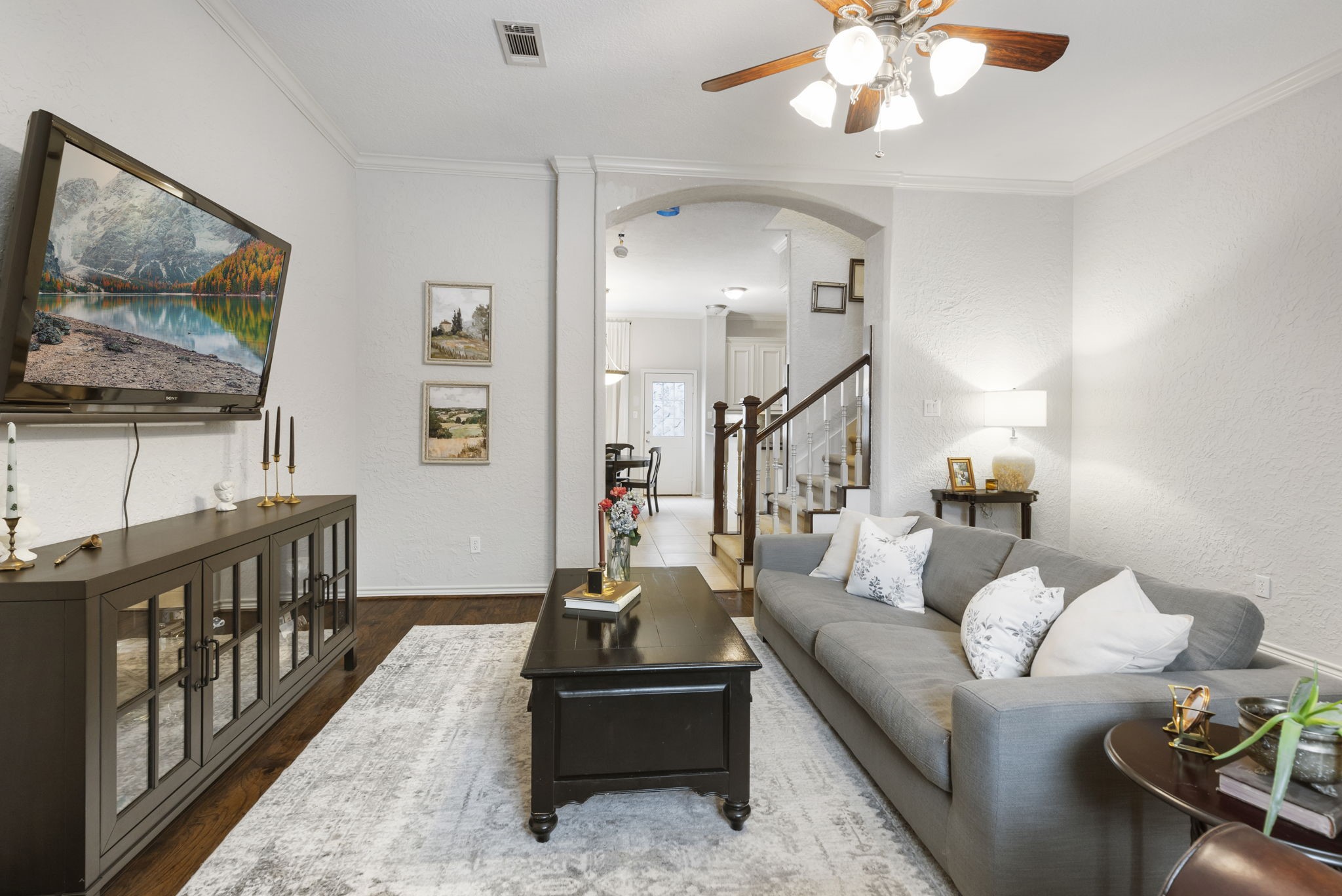 1898 Longmire Road, Unit 8 Conroe, TX 77304 - Photo 5 of 26 a living room with furniture and a flat screen tv