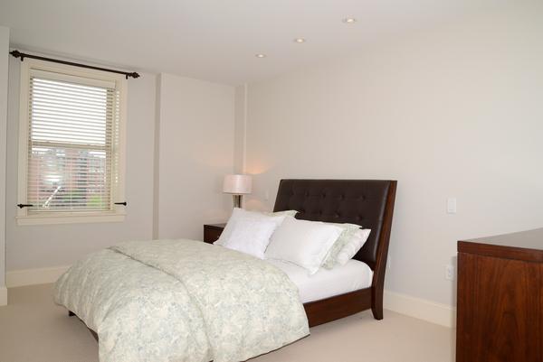 116-128 Rantoul Street, Unit 507 Beverly, MA 01915 - Photo 9 of 13 a bedroom with a bed and window