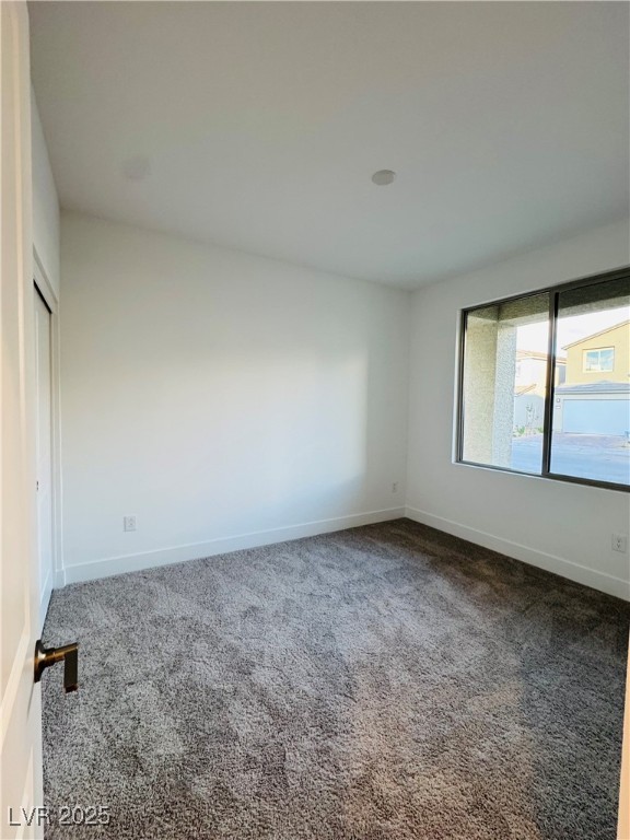 10237 Mystic Falls Drive Las Vegas, NV 89141 - Photo 13 of 23 Spare room featuring carpet and baseboards