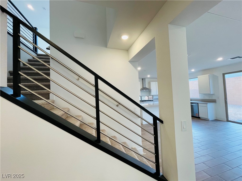 10237 Mystic Falls Drive Las Vegas, NV 89141 - Photo 7 of 23 Staircase featuring tile patterned flooring and recessed lighting