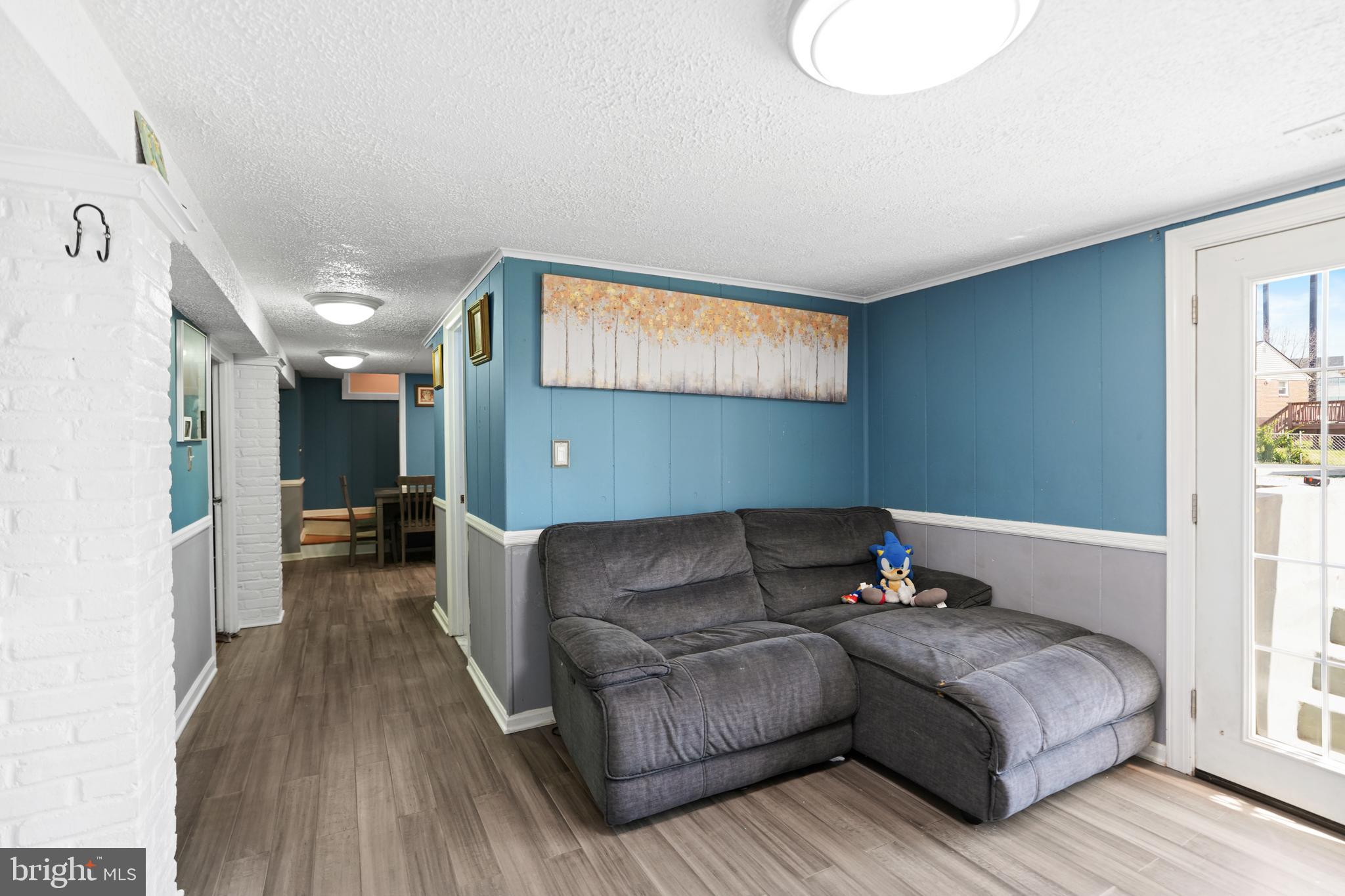 3414 Farthing Drive Silver Spring, MD 20906 - Photo 11 of 23 a living room with furniture and a flat screen tv