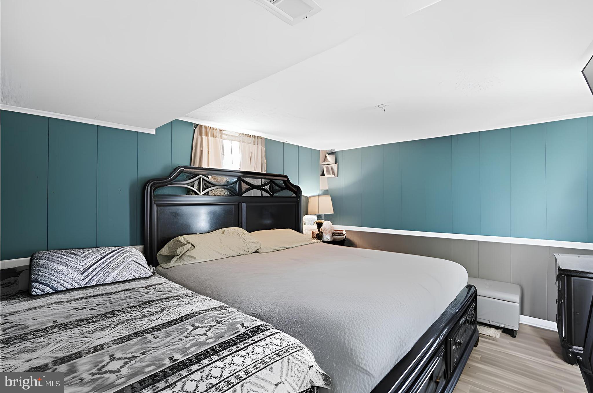 3414 Farthing Drive Silver Spring, MD 20906 - Photo 16 of 23 a bedroom with a bed and a lamp