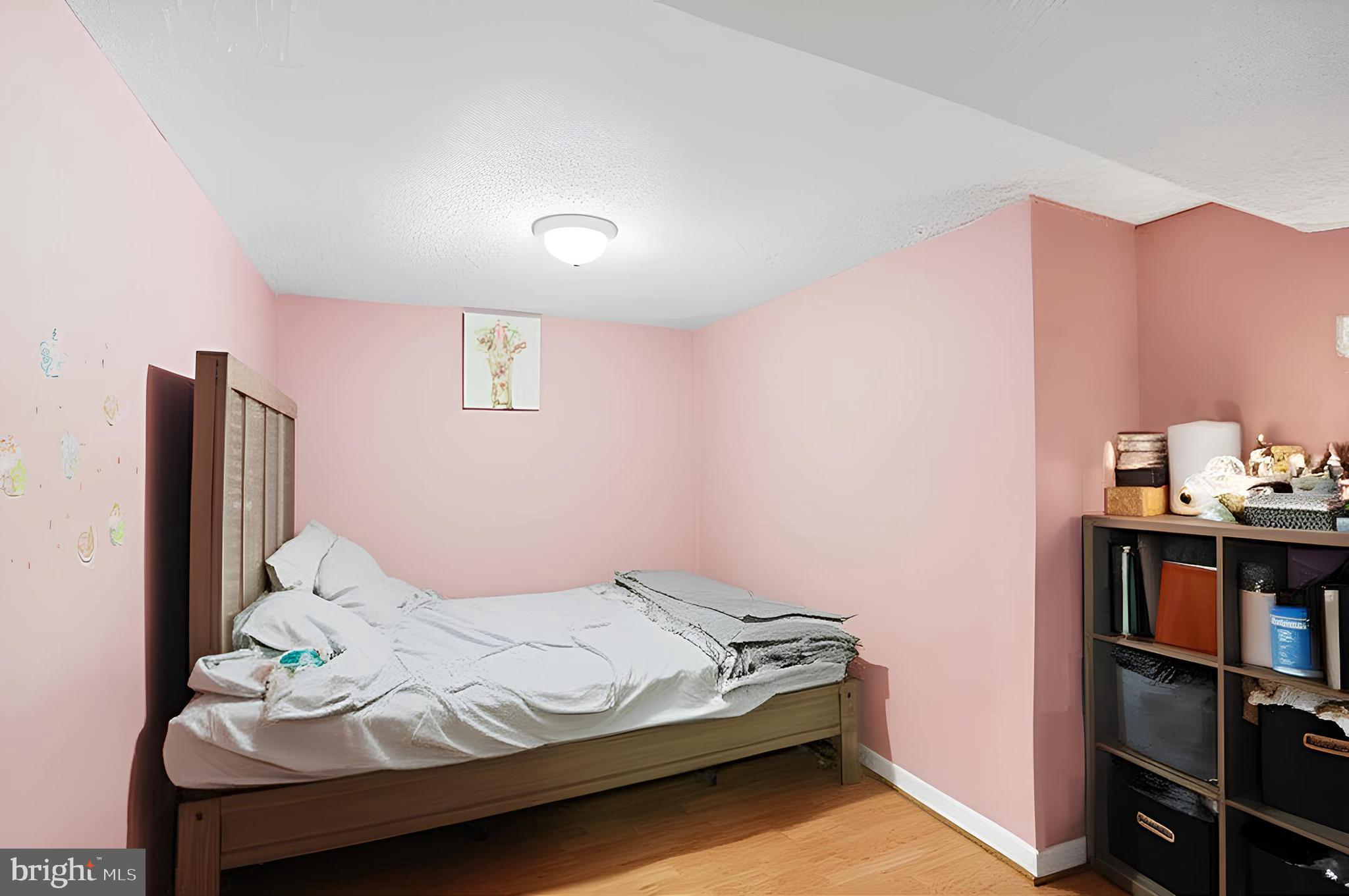 3414 Farthing Drive Silver Spring, MD 20906 - Photo 17 of 23 a bedroom with a bed and a book shelf