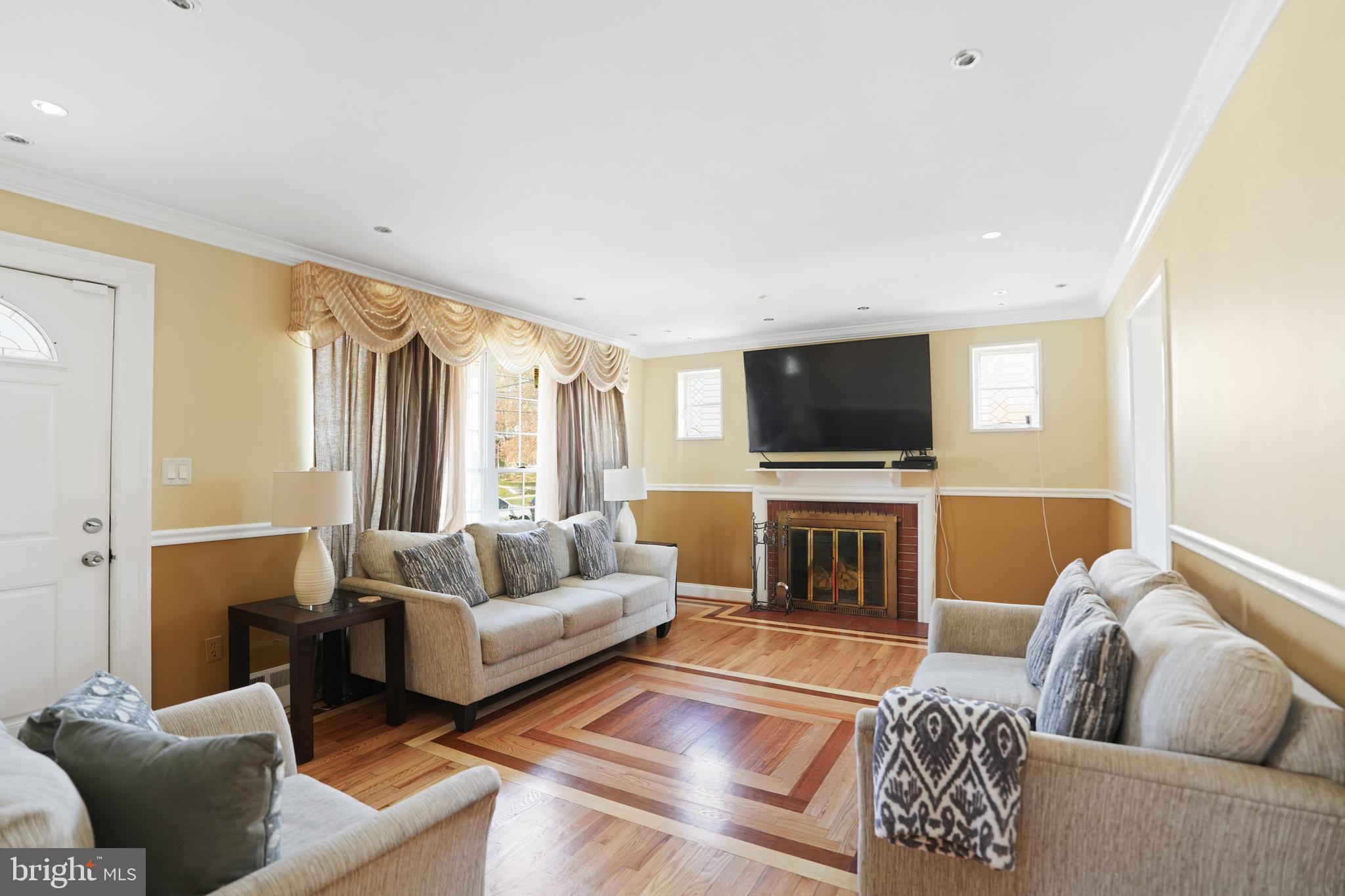 3414 Farthing Drive Silver Spring, MD 20906 - Photo 2 of 23 a living room with furniture and a flat screen tv