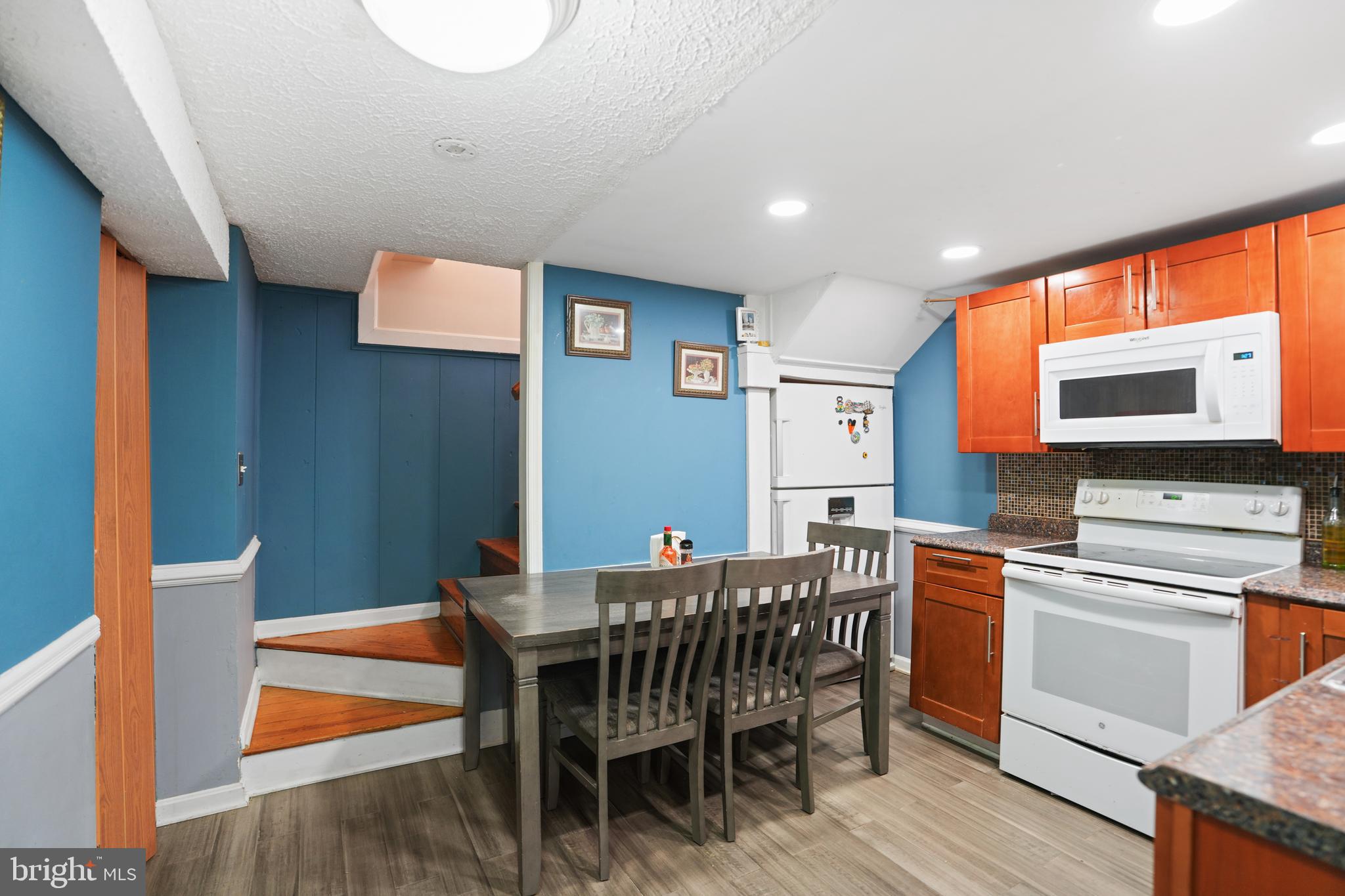 3414 Farthing Drive Silver Spring, MD 20906 - Photo 4 of 23 a dining room with a wooden table and chairs