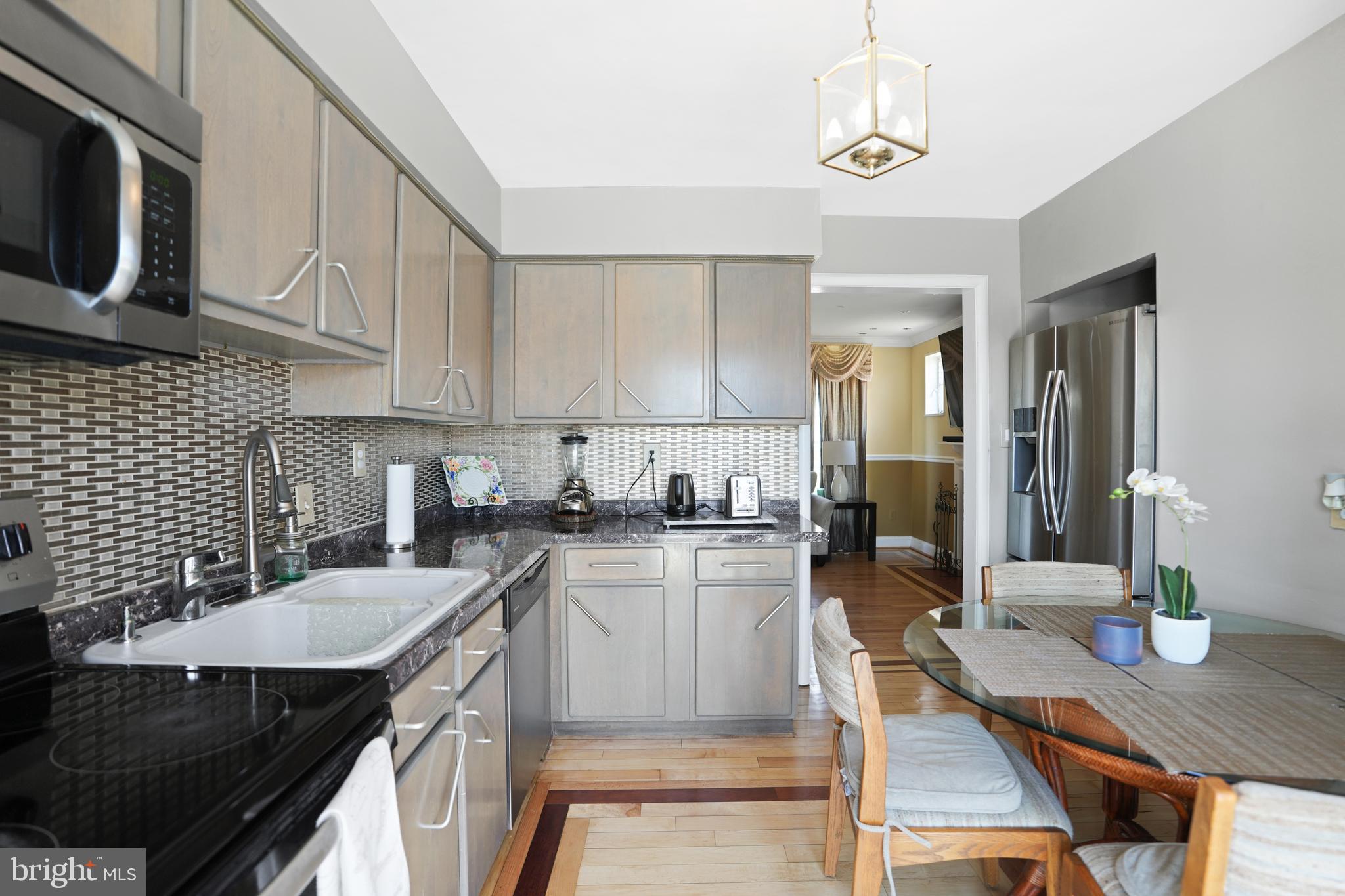 3414 Farthing Drive Silver Spring, MD 20906 - Photo 9 of 23 a kitchen with sink cabinets and appliances
