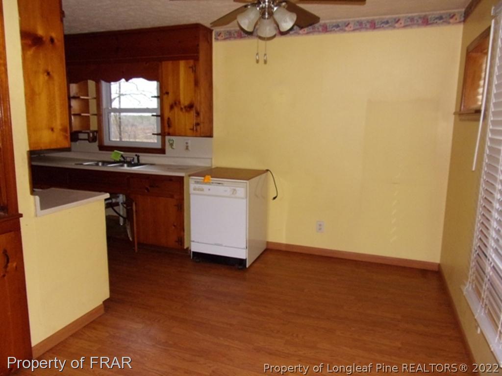 1321 Shaw Road Carthage, NC 28327 - Photo 4 of 9 a room with a sink and a large mirror next to a window