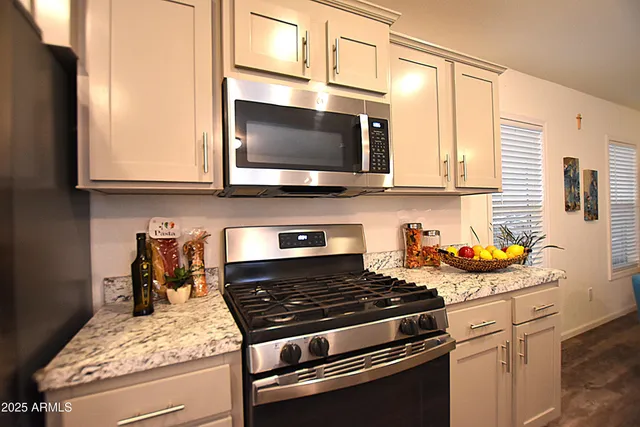 a kitchen with a stove and a microwave