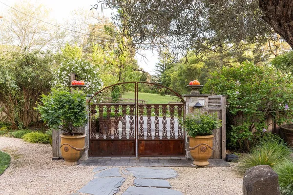 a patio with a table and chairs under an umbrella