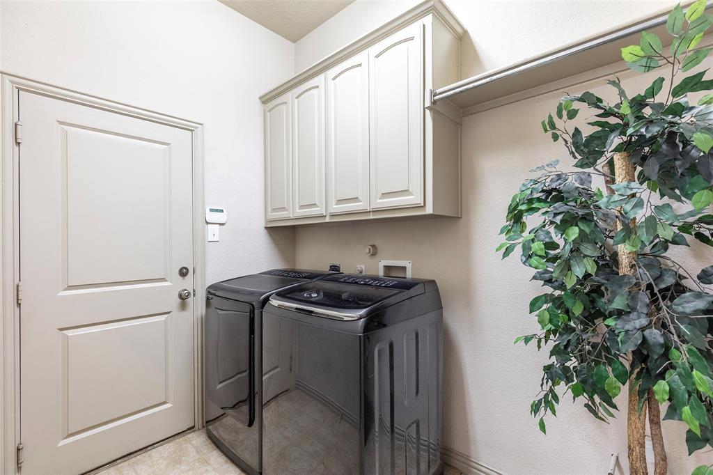 1217 Windmere Way Allen, TX 75013 - Photo 34 of 38 Thoughtfully designed with extra storage and functional workspace, the utility room keeps daily routines organized and efficient.