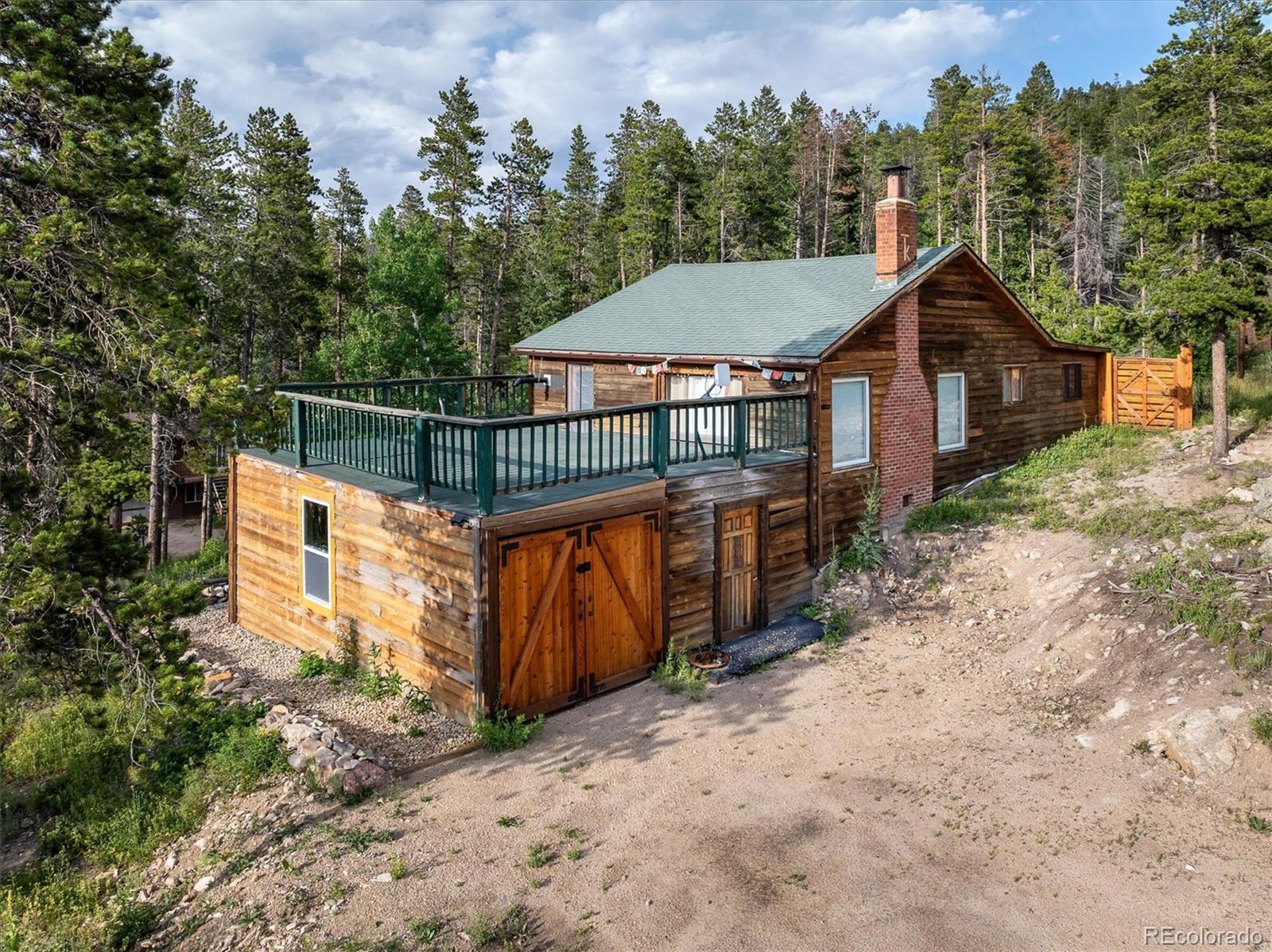 a view of a house with wooden fence