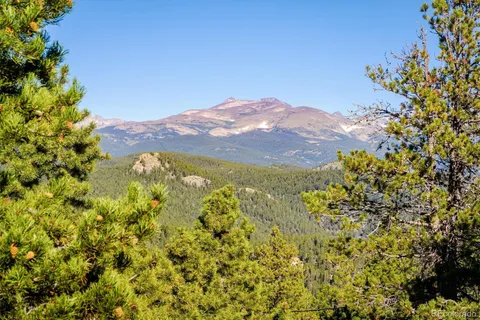 a view of a house with a mountain