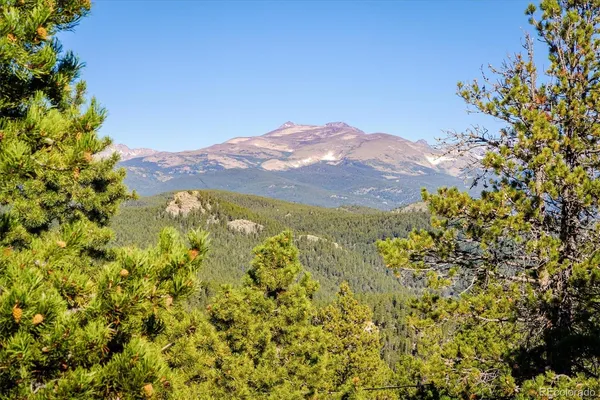 a view of a house with a mountain