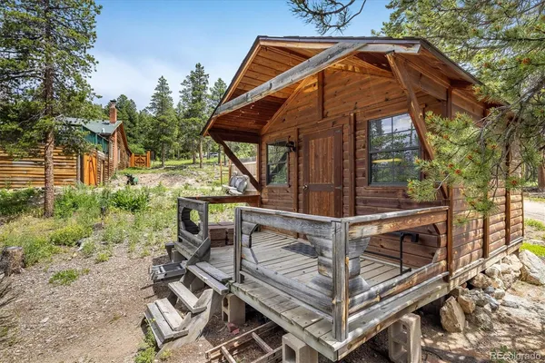 a view of balcony with wooden floor and outdoor seating