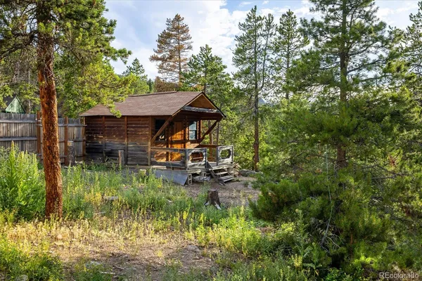an aerial view of a house with mountain view
