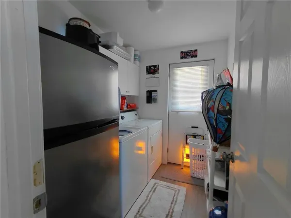 a bathroom with a granite countertop sink mirror vanity and toilet